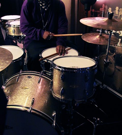 A drummer behind a glitter drum kit